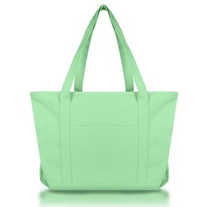 May include: A solid light mint green tote bag featuring two long shoulder straps, a rectangular main compartment, and a single horizontal exterior pocket centered on the front panel. The bag is constructed with reinforced vertical stitching.