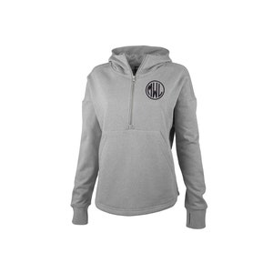 May include: A light gray hooded sweatshirt with a quarter-zip closure and a kangaroo pocket. The sweatshirt features a black circular monogram with the letters "MWL" on the upper chest. The sleeves have thumb holes at the cuffs.