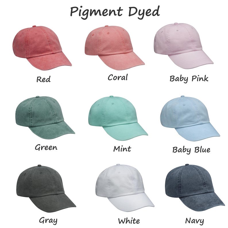May include: Nine pigment dyed baseball caps in various colors, including red, coral, baby pink, green, mint, baby blue, gray, white, and navy.