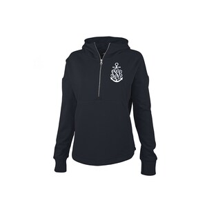 May include: Navy blue hooded sweatshirt with a quarter-zip closure and a kangaroo pocket. The sweatshirt features a white anchor design with the letters "S" and "G" intertwined. The long-sleeved top has thumb holes at the cuffs.