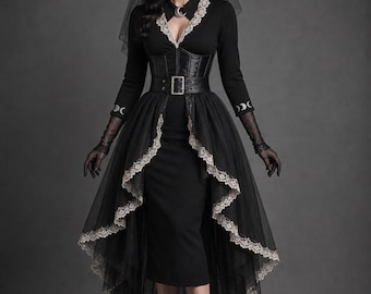 May include: A black dress featuring a high-low tulle skirt with beige lace trim, a leather-look corset belt with a silver buckle, long sleeves with moon phase embroidery, a collared neckline with a crescent moon pendant, and a matching witch hat.