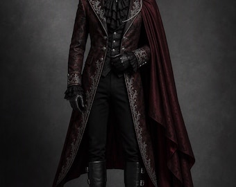 May include: A dark red brocade tailcoat with silver embroidery, a matching cape, a black ruffled jabot with a cameo brooch, a black vest, black trousers, and black leather boots. The ensemble features intricate patterns and structured tailoring.