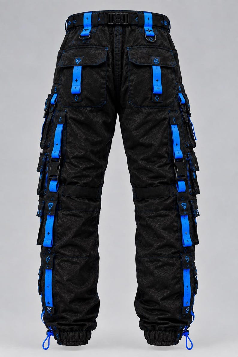 May include: Black cargo pants featuring a subtle tonal pattern, multiple side pockets, and bright blue nylon straps with black plastic buckles. The waistband includes a black buckle belt, and the leg cuffs have adjustable blue drawstrings.