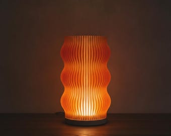 Wavy Orange Night Lamp – Modern Minimalistic Bedside Table Light for Ambient Bedroom Lighting.