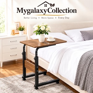 May include: A height-adjustable side table with a brown wood-grain surface and a black metal frame. The table features a C-shaped base with wheels and a horizontal support bar. The text MygalaxyCollection Better Living More Space Every Day is visible.