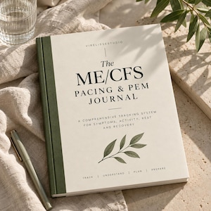May include: A hardcover journal with a cream-colored cover and a dark green spine. The text reads: VIRELISSESTUDIO, The ME/CFS PACING & PEM JOURNAL, A COMPREHENSIVE TRACKING SYSTEM FOR SYMPTOMS, ACTIVITY, REST AND RECOVERY, TRACK | UNDERSTAND | PLAN | PREPARE.