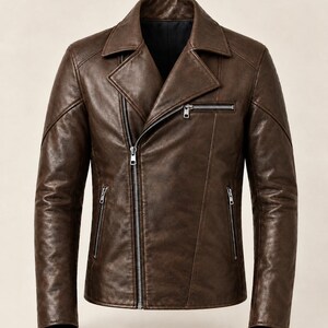 May include: A dark brown leather motorcycle jacket featuring an asymmetrical front zipper closure, a wide notched lapel collar, and three silver-toned zippered pockets on the front. The jacket has long sleeves with structured seams and a smooth finish.