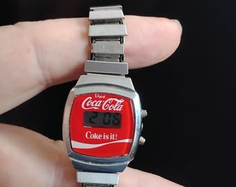 1980,s soda pop digital watch with logo on it tested and running