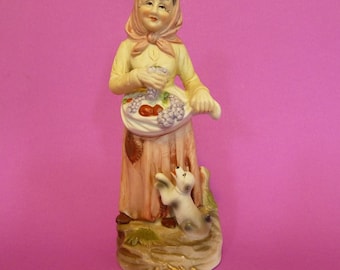 Figurine, Porcalain Figurine, Ceramic Figurine of an Old Women caring fruits in her apron.