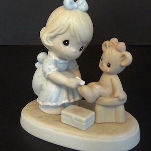 Precious Moments Figurine titled &quot;Caring&quot; 1993.