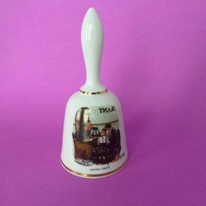 Bell, China Bell, Dinner bell a Limited Edition depicting a Norman Rockwell painting.