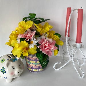 Floral Arrangement, Silk Flowers in Bright Yellow, Pink and White in a colorful basket.