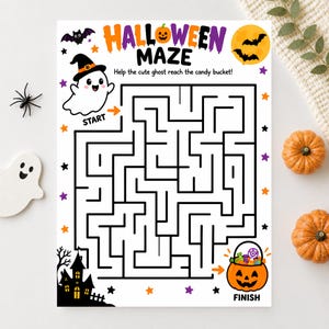 May include: A white Halloween maze activity sheet featuring a ghost in a witch hat, a black haunted house, a jack-o'-lantern candy bucket, and bats. The text reads HALLOWEEN MAZE, Help the cute ghost reach the candy bucket, START, and FINISH.