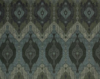 May include: A textile fabric featuring a repeating ikat-style pattern in shades of dark olive green, slate blue, and charcoal gray. The design consists of large, vertically aligned diamond shapes with blurred edges, creating a textured appearance.