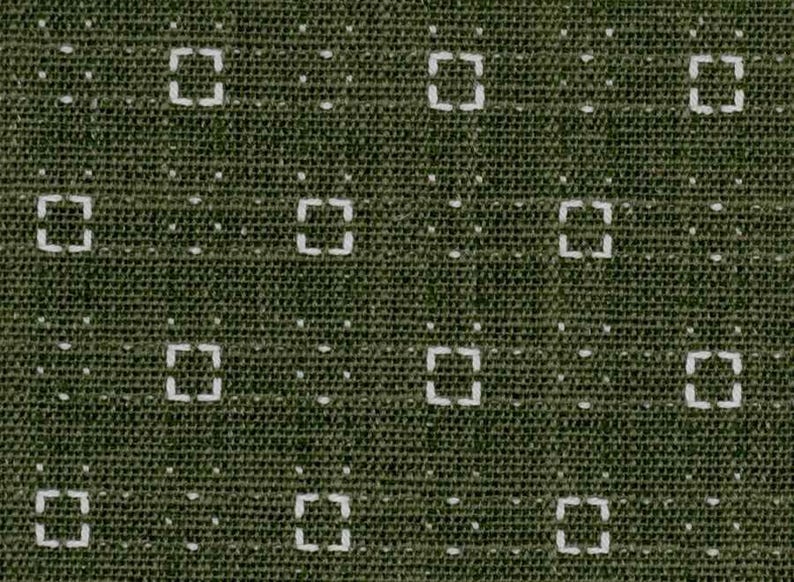 May include: A dark olive green fabric featuring a repeating geometric pattern of white embroidered squares. Each square is composed of four small dashes, interspersed with single white dots arranged in a grid across the textured textile surface.