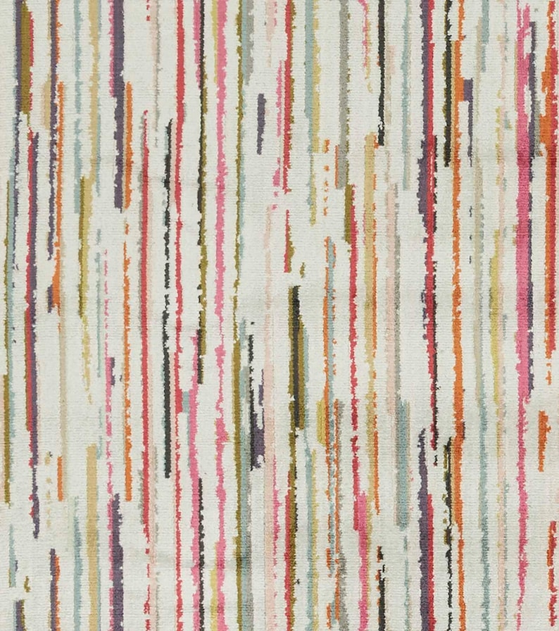 May include: A textile fabric featuring a cream-colored background with a vertical pattern of thin, irregular, and textured stripes in various colors including hot pink, orange, olive green, light blue, dark purple, and charcoal gray throughout.