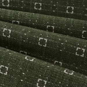 May include: A dark olive green fabric featuring a repeating pattern of small, white, dashed square outlines arranged in horizontal rows. The textile has a visible woven texture with subtle folds creating depth across the surface of the material.