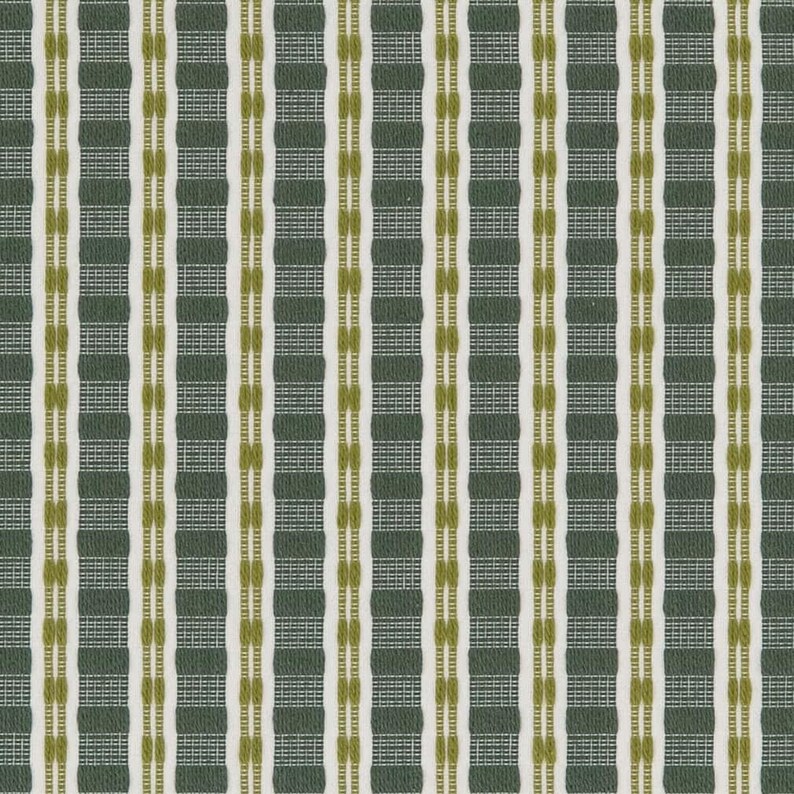 May include: A close-up of a fabric with a repeating vertical pattern. The pattern features alternating stripes of dark green, white, and olive green. The fabric has a textured appearance, with a woven or textured design. The overall aesthetic is simple and geometric.