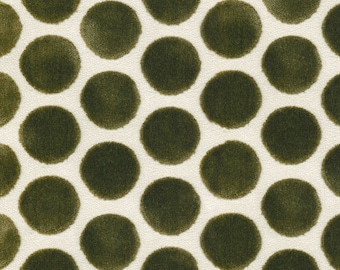 May include: A textile fabric featuring a repeating pattern of dark olive green circular shapes arranged in a staggered grid formation against a solid off-white background. The circles have a soft, textured appearance with slightly irregular edges.