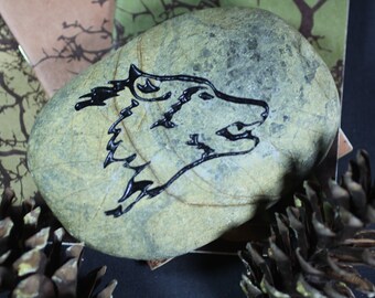 Wolf engraved stone