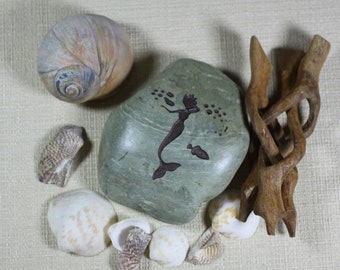 Mermaid engraved stone