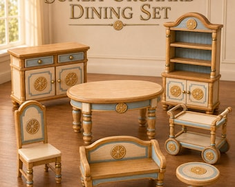 May include: A miniature dollhouse dining set labelled Sunlit Orchard Dining Set, featuring a sideboard, hutch, oval table, chair, bench, rolling cart, and small round table, all crafted in light wood with blue accents and gold wheel motifs.