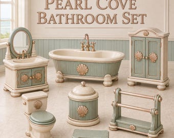 May include: A miniature bathroom set titled Pearl Cove Bathroom Set, featuring a bathtub, vanity with mirror, toilet, cabinet, towel rack, and small bench. Each piece is painted in cream and sage green with gold-toned seashell accents.