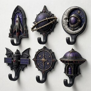 May include: A set of six decorative wall hooks featuring space-themed designs including a rocket in a gothic arch, a ringed planet, an astronaut with a crescent moon, a bat-shaped satellite, a celestial compass, and a domed observatory structure.