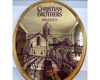 Vintage Christian Brothers Brandy ovale barspiegel met houten frame, 21x17 cm, gemaakt in de VS.
