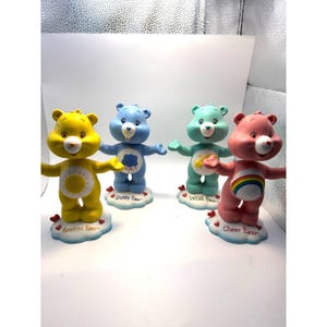 Set de 4 figuras cabezonas vintage de los Ositos Cariñositos: Funshine Cheer y Grumpy Wish Bear.