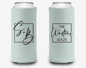 May include: Two light green can coolers with black text. One cooler has the text "S + B" inside a black square. The other cooler has the text "THE Westons 12.9.23" inside a black square.