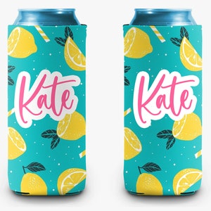 May include: Two teal can coolers with a pattern of yellow lemons and green leaves. The name "Kate" is written in pink script across the front of each cooler. Each cooler has a white border.