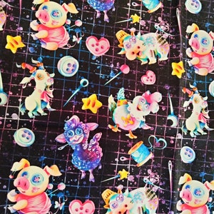May include: A black fabric with a repeating pattern of colorful cartoon animals, stars, buttons, and sewing needles. The animals include a pig, a sheep, a cow, and a unicorn. The background is a dark blue with a grid pattern.