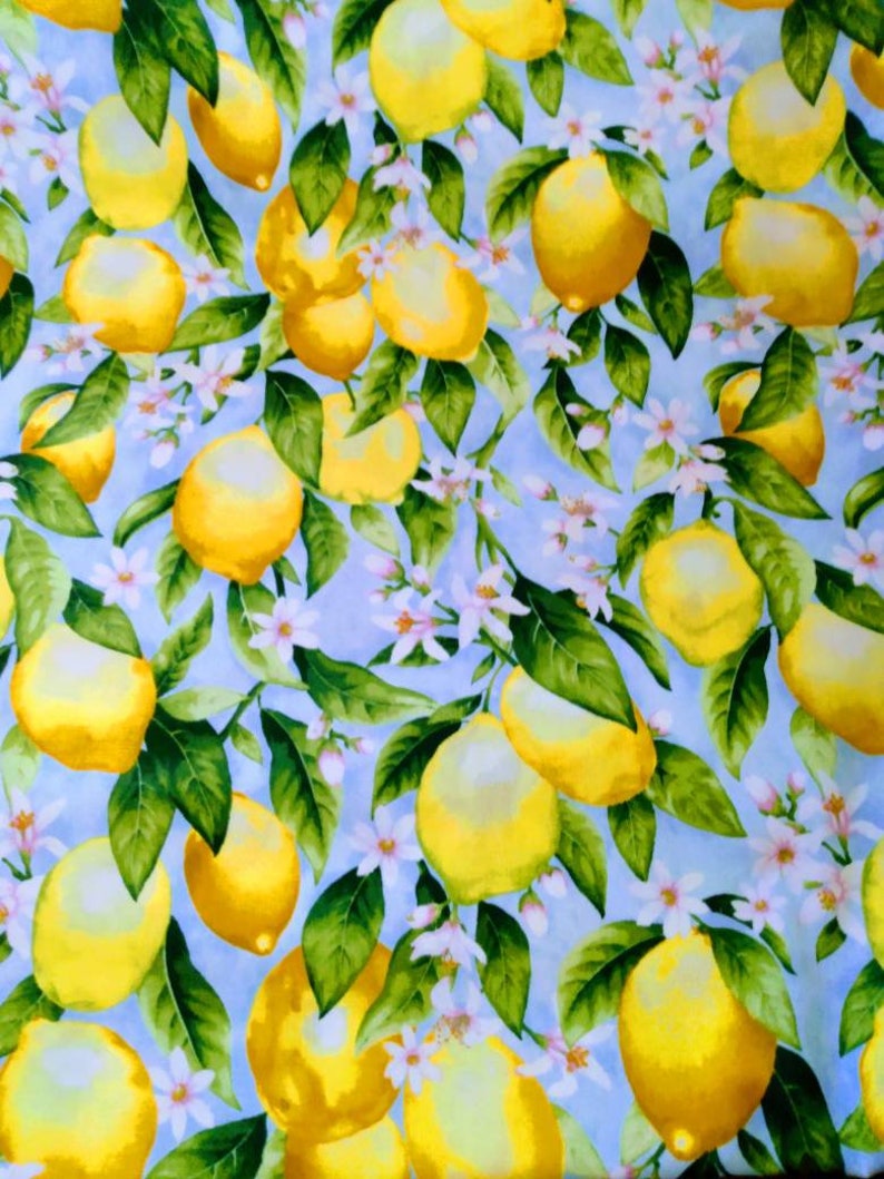 May include: A blue background with a repeating pattern of yellow lemons and white flowers. The lemons are arranged in a random pattern and are surrounded by green leaves.