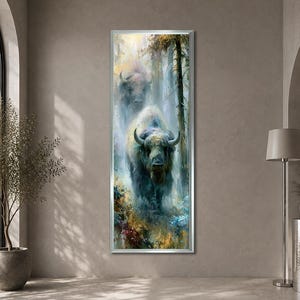 May include: A vertical rectangular wall art print featuring a large bison standing in a misty, dense forest. The bison is rendered in shades of blue, grey, and white, surrounded by dark trees and colorful, textured foliage in the foreground.