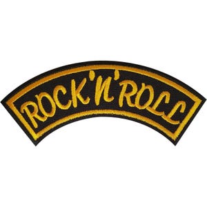 May include: A curved embroidered patch with a black background and a yellow border. The text ROCK 'N' ROLL is stitched in yellow thread across the centre of the patch in a bold, stylised font that follows the arc of the design.