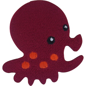 May include: A dark maroon octopus-shaped embroidered patch featuring a large rounded head, two black eyes with white highlights, and several orange circular spots on the lower body section, with multiple tentacles extending from the base.