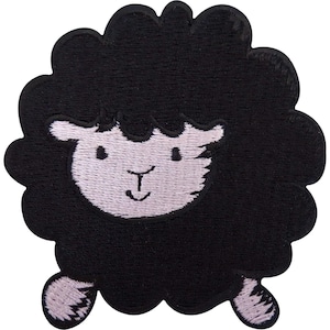 May include: An embroidered patch featuring a stylized black sheep with a fluffy, rounded body and a light-colored face. The sheep has simple stitched facial features, including two small eyes and a curved mouth, with two small light-colored feet visible.