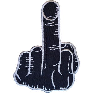 May include: A black embroidered patch in the shape of a hand making a middle finger gesture. The design features white stitched outlines and detailing to define the fingers, knuckles, and hand shape against the solid black fabric background.