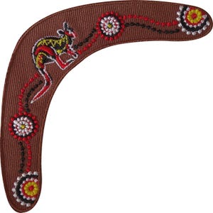 May include: A brown boomerang-shaped embroidered patch featuring a stylized kangaroo figure in red, yellow, and black thread. The design includes circular floral-like motifs in white, red, yellow, and black, connected by dotted lines of red and black thread.