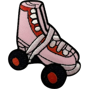 May include: An embroidered patch shaped like a roller skate. The skate is light pink with white laces and a red tongue. It features two black wheels with orange centers. The entire design is outlined in a thick black border, creating a distinct shape.