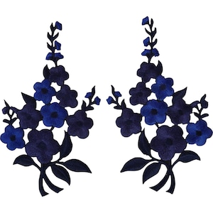 May include: Two symmetrical embroidered floral patches featuring deep blue and royal blue petals with dark navy leaves and stems. The intricate needlework creates a layered botanical design with multiple blossoms arranged in a vertical spray pattern.