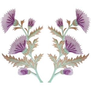 May include: Two symmetrical embroidered thistle patches featuring vibrant purple flower heads with deep violet centres. The stems and jagged, spiky leaves are rendered in shades of light green and tan, showcasing detailed thread work throughout.
