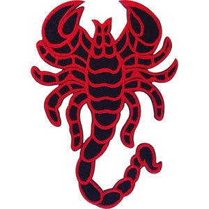 May include: An embroidered patch featuring a stylized scorpion design. The scorpion is rendered in a bold color scheme of deep black and vibrant red, with red outlines defining the segmented body, pincers, and the curved tail with a stinger.