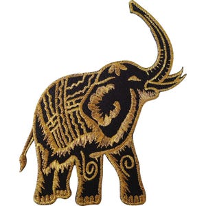 May include: An embroidered patch in the shape of an elephant, featuring a black base with intricate gold thread detailing. The elephant is depicted in profile with its trunk raised, showcasing decorative patterns on its body and legs.