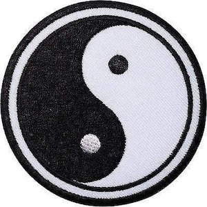 May include: A circular embroidered patch featuring a black and white yin yang symbol. The design consists of two interlocking teardrop shapes, one black with a white dot and one white with a black dot, enclosed by a thick black circular border.