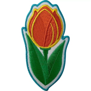 May include: An embroidered patch in the shape of a tulip flower. The tulip head is orange with yellow accents, and the stem and two leaves are green. The entire design is outlined in a bright turquoise border against a white background.