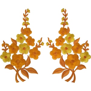 May include: Two symmetrical embroidered floral patches featuring a vertical arrangement of five-petaled flowers in shades of bright yellow and deep orange. Each patch includes detailed stems and leaves at the base, rendered in a consistent orange thread.