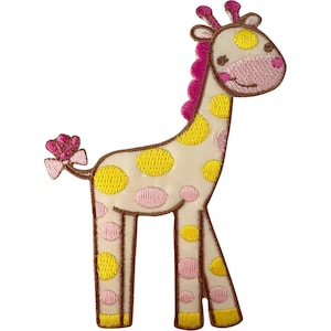 May include: An embroidered iron-on patch shaped like a giraffe. The giraffe has a cream-coloured body with yellow and pink spots, a pink mane, a pink snout, and a small pink bow on its tail. The edges are outlined in dark brown thread.