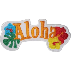May include: An embroidered patch featuring the word Aloha in orange thread. The design includes a blue hibiscus flower and a green monstera leaf on the left side, and a yellow and red hibiscus flower on the right side, all on a white background.